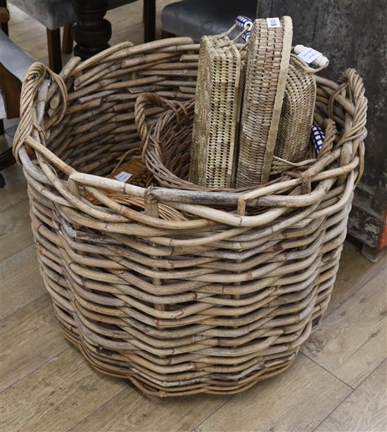 A collection of wicker and cane baskets in sizes largest width 75cm